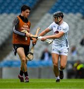 8 June 2025; Cathal McCabe of Kildare selects a replacement hurley from XXX during the Joe McDonagh Cup final match between Kildare and Laois at Croke Park in Dublin. Photo by Ray McManus/Sportsfile