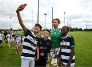 10 June 2025; Cian Lynch of Limerick with Abdall Khan Ryan Molloy, and Donald Ncube, pupils of St Brendan's National School, Birr, at the national launch of the GAA Hurling All-Ireland Senior Championship Series at GAA Faithful Fields Offaly Centre of Excellence, Kilcormac in Offaly. Photo by Ray McManus/Sportsfile