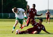 10 June 2025; Cathal O'Sullivan of Republic of Ireland in action against Ayoub Mohamed Aloui, right, and Ahmed Reyad A Fadlelmula of Qatar during the U21 international friendly match between Qatar and Republic of Ireland at Gradski Stadion in Zagreb, Croatia. Photo by Gerry Scully/Sportsfile