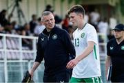 10 June 2025; Republic of Ireland U21's manager Jim Crawford talks with Jacob Slater of Republic of Ireland as they leave the field at half time during the U21 international friendly match between Qatar and Republic of Ireland at Gradski Stadion in Zagreb, Croatia. Photo by Gerry Scully/Sportsfile
