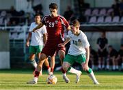 10 June 2025; Jamie Mullins of Republic of Ireland in action against Moath Ibrahim M Mohammadtaha of Qatar during the U21 international friendly match between Qatar and Republic of Ireland at Gradski Stadion in Zagreb, Croatia. Photo by Gerry Scully/Sportsfile