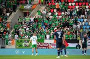 10 June 2025; Republic of Ireland supporters hold up red cards during the international friendly match between Luxembourg and Republic of Ireland at Stade de Luxembourg in Luxembourg. Photo by Stephen McCarthy/Sportsfile