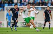 10 June 2025; Killian Phillips of Republic of Ireland in action against Eldin Dzogovic of Luxembourg during the international friendly match between Luxembourg and Republic of Ireland at Stade de Luxembourg in Luxembourg. Photo by Stephen McCarthy/Sportsfile