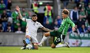10 June 2025; Isaac Price of Northern Ireland in action against Victor Pálsson of Iceland during the International Friendly match between Northern Ireland and Iceland at Clearer Twist National Football Stadium at Windsor Park in Belfast. Photo by Ramsey Cardy/Sportsfile