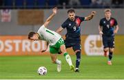 10 June 2025; Kasey McAteer of Republic of Ireland is tackled by Danel Sinani of Luxembourg tussle during the international friendly match between Luxembourg and Republic of Ireland at Stade de Luxembourg in Luxembourg. Photo by Stephen McCarthy/Sportsfile