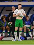 10 June 2025; Republic of Ireland head coach Heimir Hallgrimsson looks on as Jake O'Brien of Republic of Ireland dries the ball in preperation to take a throw-in during the international friendly match between Luxembourg and Republic of Ireland at Stade de Luxembourg in Luxembourg. Photo by Stephen McCarthy/Sportsfile