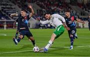 10 June 2025; Troy Parrott of Republic of Ireland in action against Seid Korac, left, and Eldin Dzogovic of Luxembourg during the international friendly match between Luxembourg and Republic of Ireland at Stade de Luxembourg in Luxembourg. Photo by Stephen McCarthy/Sportsfile