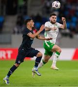 10 June 2025; Ryan Manning of Republic of Ireland in action against Eldin Dzogovic of Luxembourg during the international friendly match between Luxembourg and Republic of Ireland at Stade de Luxembourg in Luxembourg. Photo by Stephen McCarthy/Sportsfile
