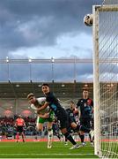 10 June 2025; Nathan Collins of Republic of Ireland has a header on goal under pressure from Seid Korac of Luxembourg during the international friendly match between Luxembourg and Republic of Ireland at Stade de Luxembourg in Luxembourg. Photo by Stephen McCarthy/Sportsfile