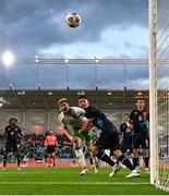 10 June 2025; Nathan Collins of Republic of Ireland has a header on goal under pressure from Seid Korac of Luxembourg during the international friendly match between Luxembourg and Republic of Ireland at Stade de Luxembourg in Luxembourg. Photo by Stephen McCarthy/Sportsfile
