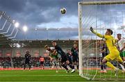 10 June 2025; Nathan Collins of Republic of Ireland has a header on goal under pressure from Seid Korac of Luxembourg during the international friendly match between Luxembourg and Republic of Ireland at Stade de Luxembourg in Luxembourg. Photo by Stephen McCarthy/Sportsfile