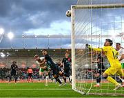 10 June 2025; Nathan Collins of Republic of Ireland has a header on goal under pressure from Seid Korac of Luxembourg during the international friendly match between Luxembourg and Republic of Ireland at Stade de Luxembourg in Luxembourg.  Photo by Stephen McCarthy/Sportsfile