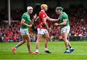 7 June 2025; Limerick players Seán Finn, right, and Kyle Hayes celebrate winning a free against Shane Barrett of Cork during the Munster GAA Hurling Senior Championship final match between Limerick and Cork at TUS Gaelic Grounds in Limerick. Photo by Piaras Ó Mídheach/Sportsfile