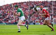 7 June 2025; William O'Donoghue of Limerick in action against Brian Hayes of Cork during the Munster GAA Hurling Senior Championship final match between Limerick and Cork at TUS Gaelic Grounds in Limerick. Photo by Piaras Ó Mídheach/Sportsfile