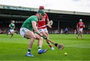 7 June 2025; Seán Finn of Limerick in action against Alan Connolly of Cork during the Munster GAA Hurling Senior Championship final match between Limerick and Cork at TUS Gaelic Grounds in Limerick. Photo by Piaras Ó Mídheach/Sportsfile