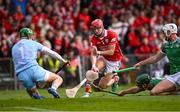 7 June 2025; Seán Finn of Limerick, below, flicks the ball away from Alan Connolly of Cork during the Munster GAA Hurling Senior Championship final match between Limerick and Cork at LIT Gaelic Grounds in Limerick. Photo by Piaras Ó Mídheach/Sportsfile
