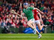 7 June 2025; Shane O'Brien of Limerick gets past Eoin Downey of Cork on the way to scoring his side's second goal during the Munster GAA Hurling Senior Championship final match between Limerick and Cork at TUS Gaelic Grounds in Limerick. Photo by Piaras Ó Mídheach/Sportsfile