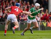 7 June 2025; Aaron Gillane of Limerick in action against Seán O'Donoghue of Cork during the Munster GAA Hurling Senior Championship final match between Limerick and Cork at TUS Gaelic Grounds in Limerick. Photo by Piaras Ó Mídheach/Sportsfile
