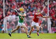 7 June 2025; Cathal O'Neill of Limerick in action against Mark Coleman of Cork during the Munster GAA Hurling Senior Championship final match between Limerick and Cork at TUS Gaelic Grounds in Limerick. Photo by Piaras Ó Mídheach/Sportsfile