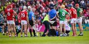 7 June 2025; Referee Thomas Walsh receives medical attention for an injury before being replaced by standy referee James Owens during the Munster GAA Hurling Senior Championship final match between Limerick and Cork at TUS Gaelic Grounds in Limerick. Photo by Piaras Ó Mídheach/Sportsfile