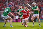 7 June 2025; Niall O'Leary of Cork in action against Cian Lynch, right, and Shane O'Brien of Limerick during the Munster GAA Hurling Senior Championship final match between Limerick and Cork at TUS Gaelic Grounds in Limerick. Photo by Piaras Ó Mídheach/Sportsfile
