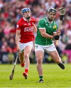 7 June 2025; Darragh O'Donovan of Limerick shoots under pressure from Diarmuid Healy of Cork during the Munster GAA Hurling Senior Championship final match between Limerick and Cork at TUS Gaelic Grounds in Limerick. Photo by Piaras Ó Mídheach/Sportsfile