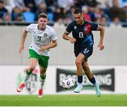 10 June 2025; Dirk Carlson of Luxembourg in action against Evan Ferguson of Republic of Ireland during the international friendly match between Luxembourg and Republic of Ireland at Stade de Luxembourg in Luxembourg. Photo by Stephen McCarthy/Sportsfile