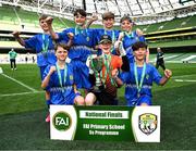 11 June 2025; Lusk SNS, Dublin, players; Finn Hurley, Patryk Jachymczak, Jamie Walsh, Harley Christie, Harry Gleeson, Dylan Maguire, Miki Jachymczak celebrate with the cup trophy winning the section C cup, for mixed large sized schools, during the FAI Primary 5s Finals Day at the Aviva Stadium in Dublin. Photo by Seb Daly/Sportsfile