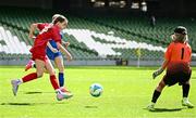 11 June 2025; Aoife Halley of Monaleen NS, Limerick, scores a goal, past Andrea Inglis of St Patrick’s NS, Diswellstown, Dublin, during the FAI Primary 5s Finals Day at the Aviva Stadium in Dublin. Photo by Seb Daly/Sportsfile