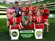 11 June 2025; Monaleen NS, Limerick, players; Faye Foley, Jolie O’Brien, Kate Sheehan, Emma Sheahan, Esme McDonald, Aoife Halley, Gwen McDonald, Isabelle McPhillips, Olivia Morgan and Louise O'Sullivan celebrate with the trophy after winning the girls section C cup, for large sized schools, during the FAI Primary 5s Finals Day at the Aviva Stadium in Dublin. Photo by Seb Daly/Sportsfile