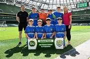 11 June 2025; Kentstown NS, Meath, players; Tomás Melia, Austin Barry, Kai Phoenix, Cian Clarke, Cathal Cummins, Max Kearns, Oisín Melia, Dáire Griffin and teachers Seán Mc Kiernan and Fr David Brennan before the FAI Primary 5s Finals Day at the Aviva Stadium in Dublin. Photo by Seb Daly/Sportsfile