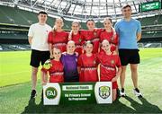 11 June 2025; Gaelscoil Uí Drisceoil, Corcaigh, players; Aisling Ní Mhathúna, Éinín Nic Cumascaigh, Juliet Ní Mhurchú, Ailbhe Ní Bhrádaigh, Becky Rylands, Bláthnaid McNally, Skye Collins, Cliona Reaney and teachers Seán de Nógla and Éanna Ó Duinnín before the FAI Primary 5s Finals Day at the Aviva Stadium in Dublin. Photo by Seb Daly/Sportsfile