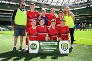 11 June 2025; Scoil Niocláis, Corcaigh, players; Tom Butler, Darragh Fields, David Vojnovic, Ned MacSweeney, Harry Randles, John Sweeney, Luke McManus, Senan Ring  and teachers Laura Breen and Des Moynihan during the FAI Primary 5s Finals Day at the Aviva Stadium in Dublin. Photo by Seb Daly/Sportsfile