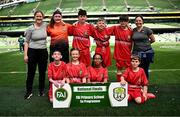 11 June 2025; St Columba’s NS, Cork, players; Saoirse Breen, Ebtesam Al Bandiri, Gearóid Cunningham, Ellie Murphy, Joshua Butler, Keelan Noonan, Cian Higgins, Kayden Deasy and teachers Mary Hennessy and Karen Cinnamond during the FAI Primary 5s Finals Day at the Aviva Stadium in Dublin. Photo by Seb Daly/Sportsfile