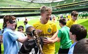 11 June 2025; Callum Mullen of Scoil Bhríde, Mullaghrafferty, Monaghan, celebrates with supporters during the FAI Primary 5s Finals Day at the Aviva Stadium in Dublin. Photo by Seb Daly/Sportsfile