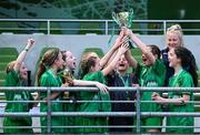11 June 2025; Scoil Fhursa, Gaillimh, players celebrate with the trophy after winning the girls section B cup, for medium schools, during the FAI Primary 5s Finals Day at the Aviva Stadium in Dublin. Photo by Seb Daly/Sportsfile