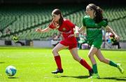 11 June 2025; Megan Davis of Cloughjordan NS, Tipperary, left, in action against Karla Gibbons of Lankill NS, Aughagower, Westport, Mayo, during the FAI Primary 5s Finals Day at the Aviva Stadium in Dublin. Photo by Seb Daly/Sportsfile
