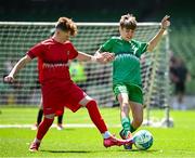 11 June 2025; Mark Macken of Cornafulla NS, Roscommon, right, in action against Eliah Kenny of Clonmoney NS, Newmarket on Fergus, Clare, during the FAI Primary 5s Finals Day at the Aviva Stadium in Dublin. Photo by Seb Daly/Sportsfile