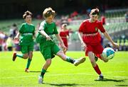 11 June 2025; Kevin Timlin of Cornafulla NS, Roscommon, left, in action against Matthew Murphy of Clonmoney NS, Newmarket on Fergus, Clare, during the FAI Primary 5s Finals Day at the Aviva Stadium in Dublin. Photo by Seb Daly/Sportsfile