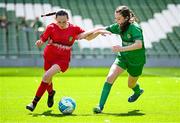 11 June 2025; Bláthnaid McNally of Gaelscoil Uí Drisceoil, Corcaigh, left, in action against Saoirse Ní Mháirtín of Scoil Fhursa, Gaillimh, during the FAI Primary 5s Finals Day at the Aviva Stadium in Dublin. Photo by Seb Daly/Sportsfile