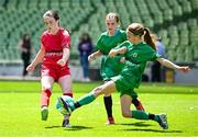 11 June 2025; Skye Collins of Gaelscoil Uí Drisceoil, Corcaigh, in action against Ruby Ní Mhaonaigh of Scoil Fhursa, Gaillimh, during the FAI Primary 5s Finals Day at the Aviva Stadium in Dublin. Photo by Seb Daly/Sportsfile