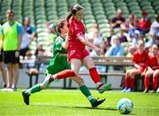 11 June 2025; Skye Collins of Gaelscoil Uí Drisceoil, Corcaigh, in action against Lauren Ní Choistealbha of Scoil Fhursa, Gaillimh, during the FAI Primary 5s Finals Day at the Aviva Stadium in Dublin. Photo by Seb Daly/Sportsfile