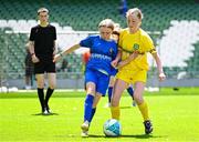 11 June 2025; Nina Naughton of Marshalstown NS, Wexford, in action against Fainche McSeain of St Felim’s NS, Ballinagh, Cavan, during the FAI Primary 5s Finals Day at the Aviva Stadium in Dublin. Photo by Seb Daly/Sportsfile
