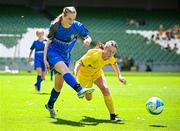 11 June 2025; Abi Doyle Kinsella of Marshalstown NS, Wexford, in action against Rose Connolly of St Felim’s NS, Ballinagh, Cavan, during the FAI Primary 5s Finals Day at the Aviva Stadium in Dublin. Photo by Seb Daly/Sportsfile