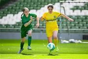 11 June 2025; Katie Ní Ghallachóir of Scoil Náisiúnta an Choimín, Dún na nGall, right, in action against Róisín O’Malley of Lankill NS, Aughagower, Westport, Mayo, during the FAI Primary 5s Finals Day at the Aviva Stadium in Dublin. Photo by Seb Daly/Sportsfile