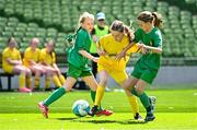 11 June 2025; Muireann McSeain of St Felim’s NS, Ballinagh, Cavan, in action against Ruby Ní Mhaonaigh of Scoil Fhursa, Gaillimh, during the FAI Primary 5s Finals Day at the Aviva Stadium in Dublin. Photo by Seb Daly/Sportsfile