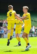 11 June 2025; Ryan Kelly of Scoil Bhríde, Mullaghrafferty, Monaghan, left, celebrates with teammate Callum Mullen after scoring a goal during the FAI Primary 5s Finals Day at the Aviva Stadium in Dublin. Photo by Seb Daly/Sportsfile
