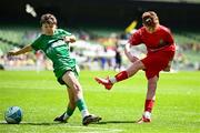11 June 2025; Eliah Kenny of Clonmoney NS, Newmarket on Fergus, Clare, in action against Paul McCarron of Cornafulla NS, Roscommon, during the FAI Primary 5s Finals Day at the Aviva Stadium in Dublin. Photo by Seb Daly/Sportsfile