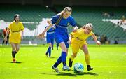 11 June 2025; Abi Doyle Kinsella of Marshalstown NS, Wexford, in action against Rose Connolly of St Felim’s NS, Ballinagh, Cavan, during the FAI Primary 5s Finals Day at the Aviva Stadium in Dublin. Photo by Seb Daly/Sportsfile