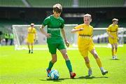 11 June 2025; Mark Macken of Cornafulla NS, Roscommon, left, in action against Rian McEneaney of Scoil Bhríde, Mullaghrafferty, Monaghan, during the FAI Primary 5s Finals Day at the Aviva Stadium in Dublin. Photo by Seb Daly/Sportsfile